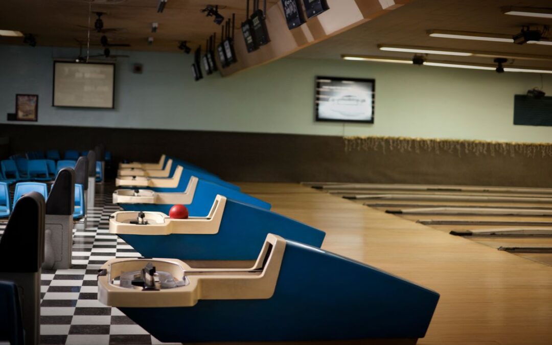 Empty bowling alley reflecting the decline in popularity compared to a historically crowded venue.